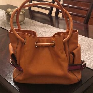Cole Haan pumpkin orange leather bucket bag